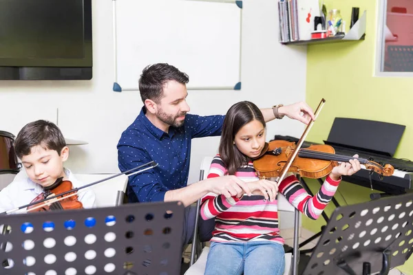 stock photo girl taking training playing violin male teacher school stock photo girl taking training playing violin male teacher school