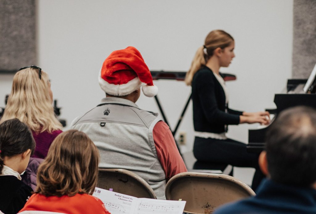 Student musician practicing stage presence before a recital performance