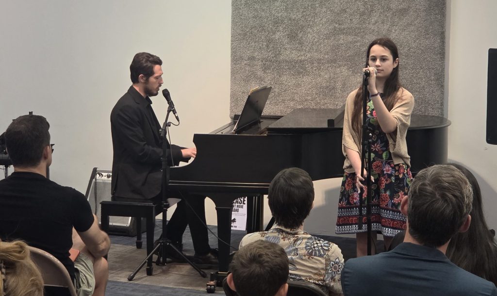 Student musician performing confidently during a music festival in Columbus, Ohio.