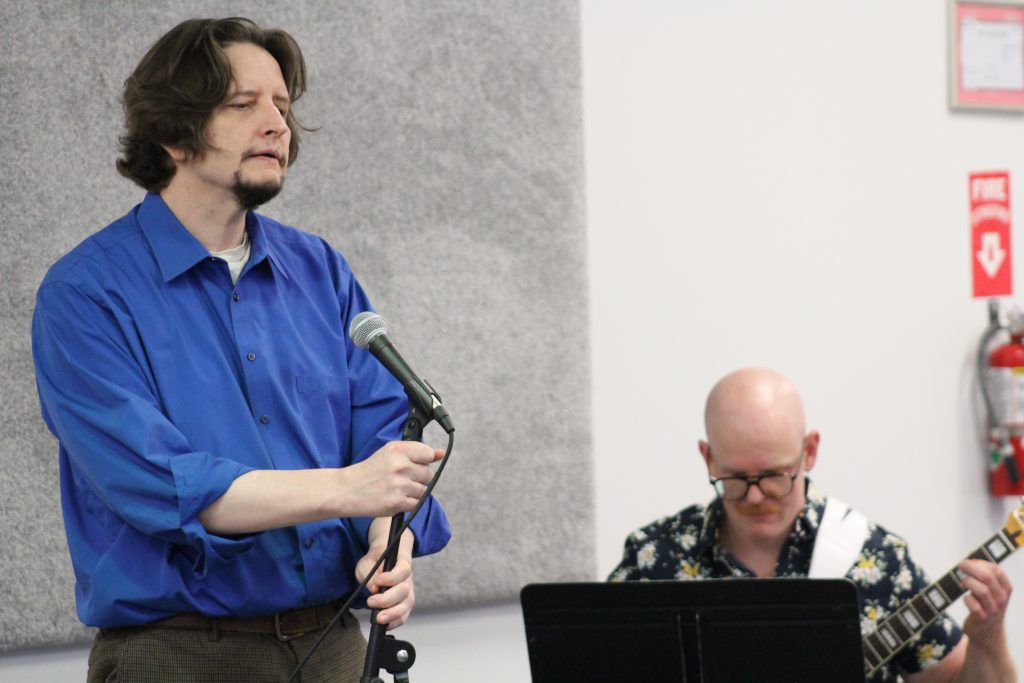 Adult music student performing during the Music Showcase at Chambers Music Studio in Columbus, Ohio.