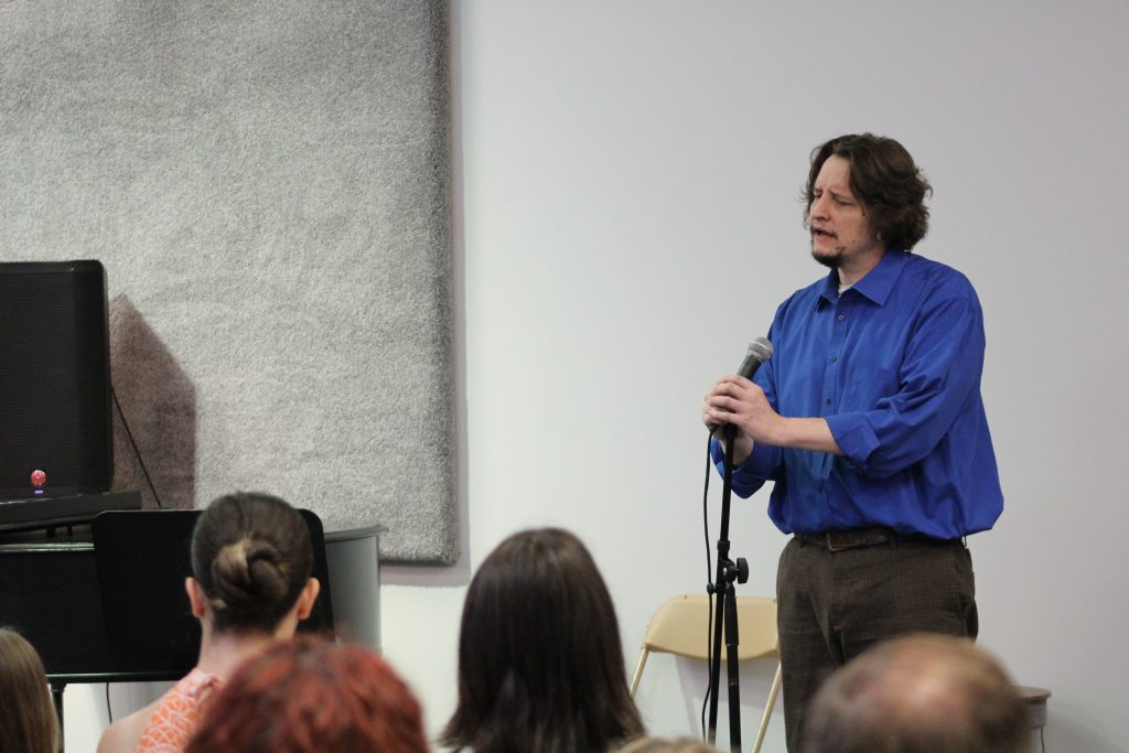 Adult music student performing in a relaxed Music Showcase setting in Columbus, Ohio.