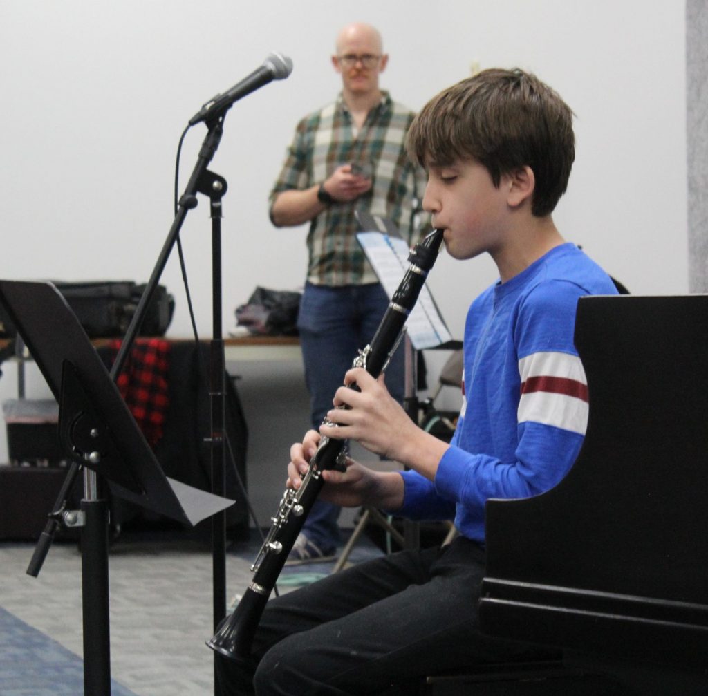 Young music student practicing a performance during Performance Month at Chambers Music Studio in Columbus, Ohio