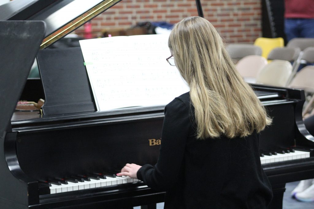 Student performing during an educational music assessment in Columbus, Ohio.