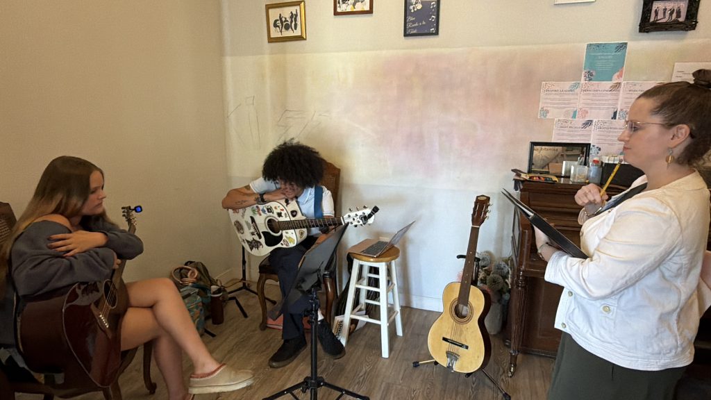 Music student exploring phrasing and expression during a supportive group Master Class.