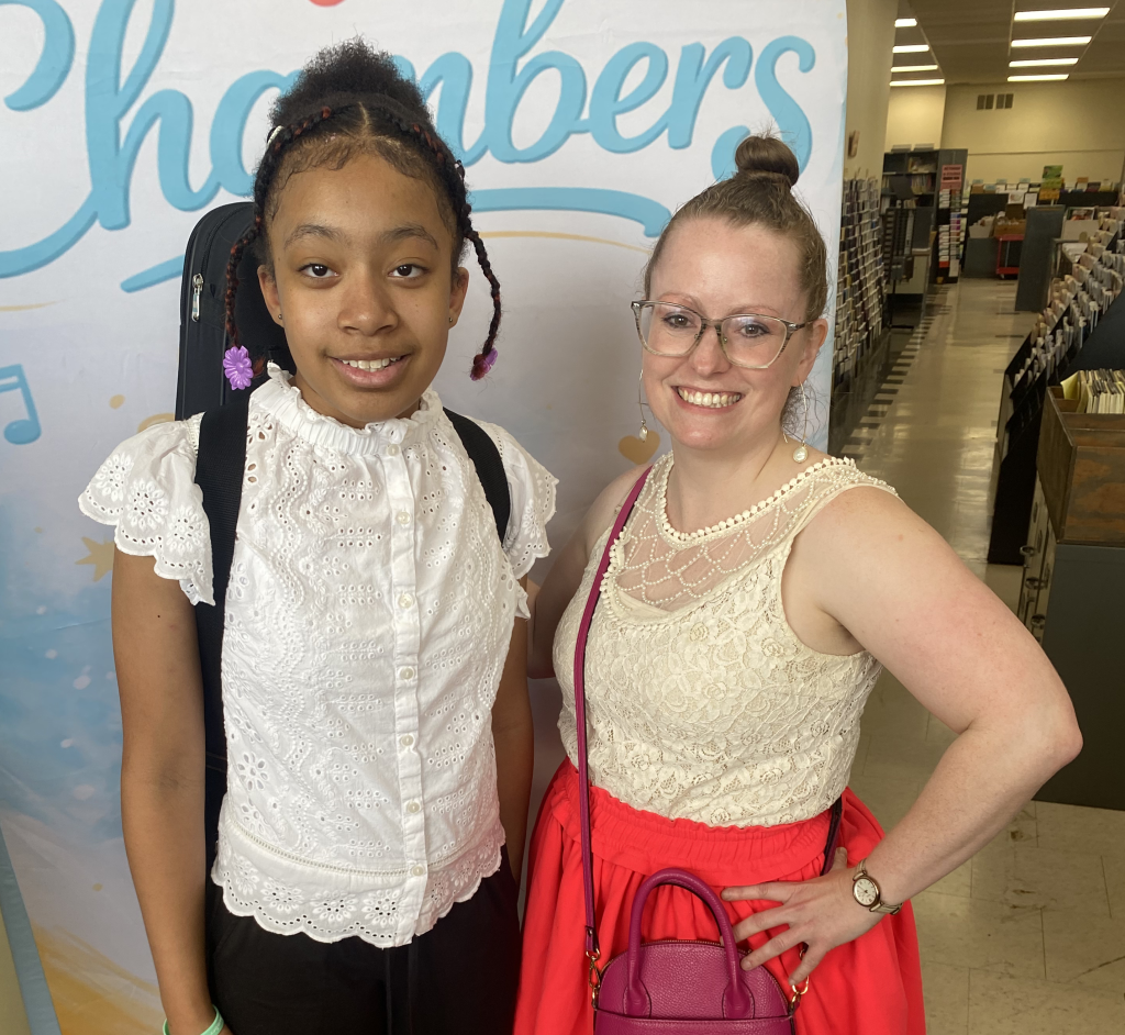 Student musician posing for a professional photograph after performing at the Life at Chambers Festival.