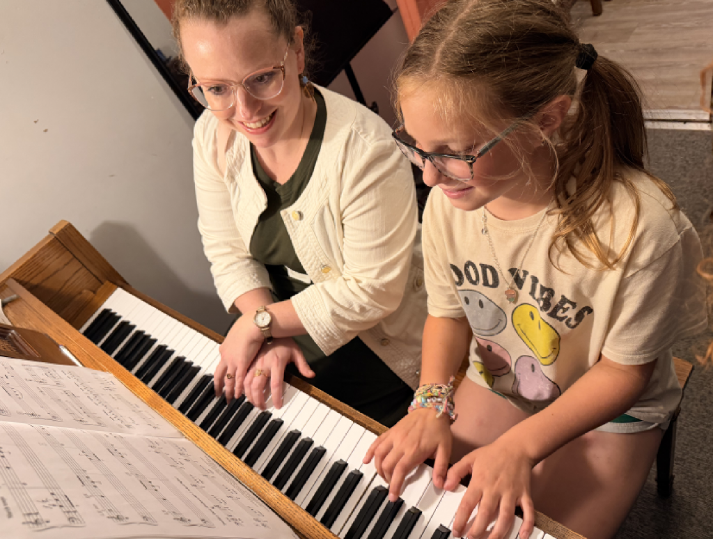 Music teacher and family setting goals for a student’s continued musical development