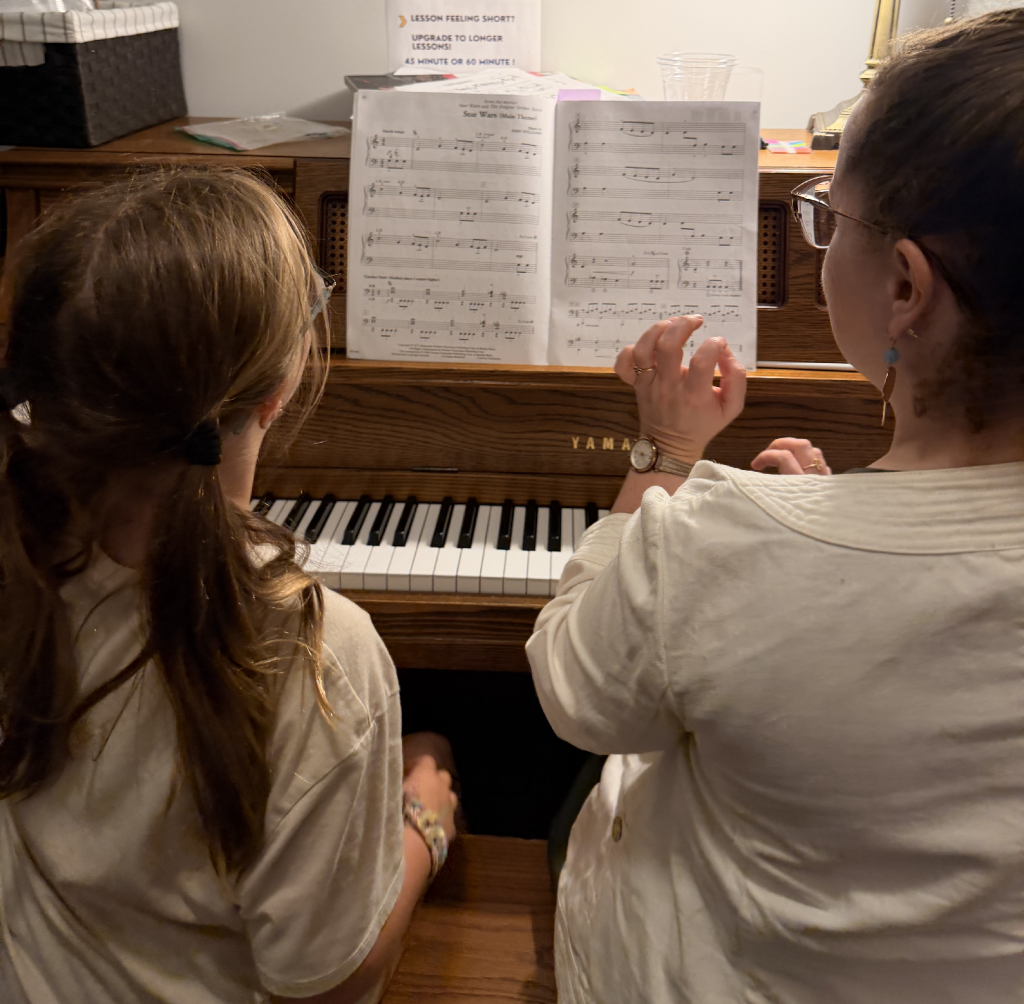 Young musician receiving supportive performance coaching during a music Master Class in Columbus, Ohio.