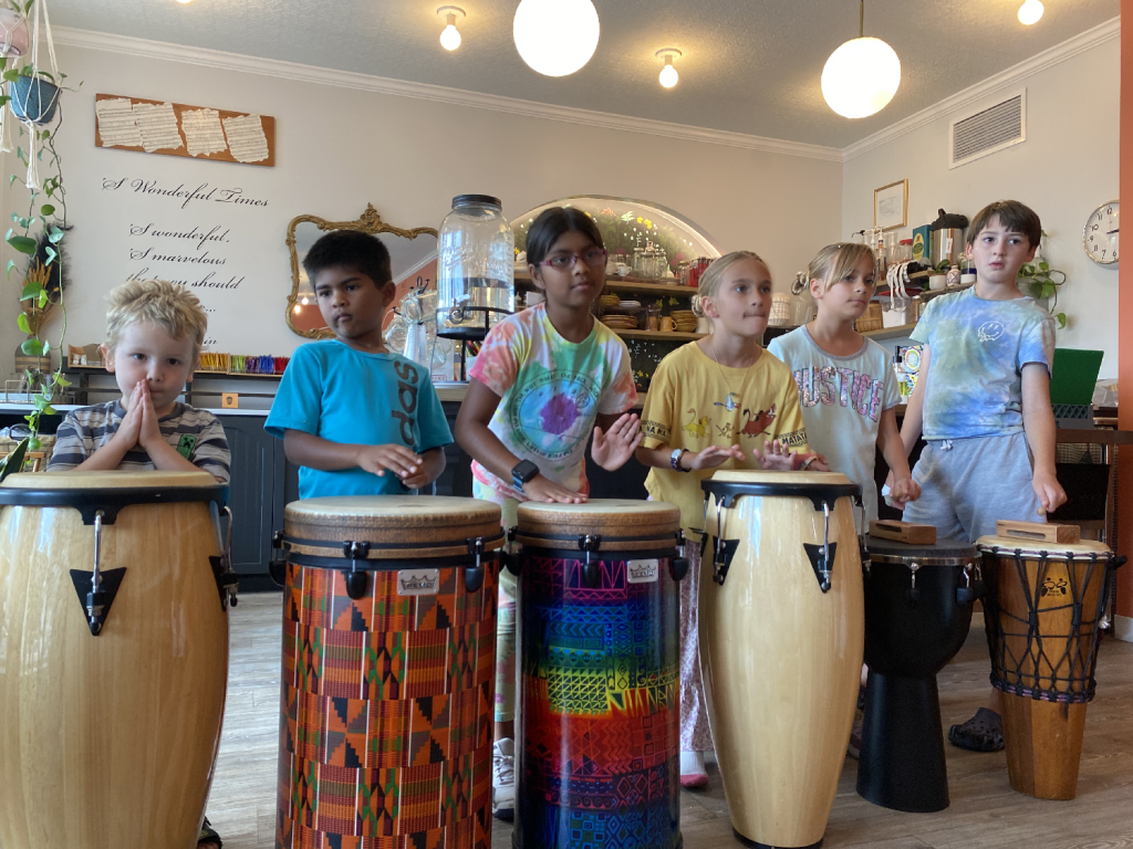 Young children participating in a creative summer music camp in Columbus, Ohio.