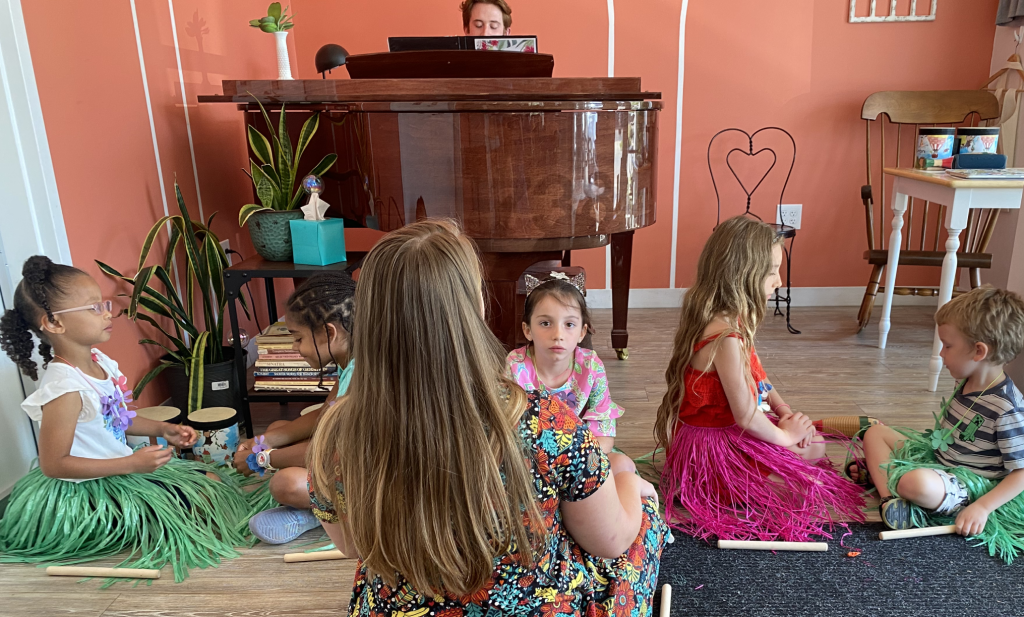 Julie Chambers smiling with students during a summer music camp or intensive in Columbus, Ohio.