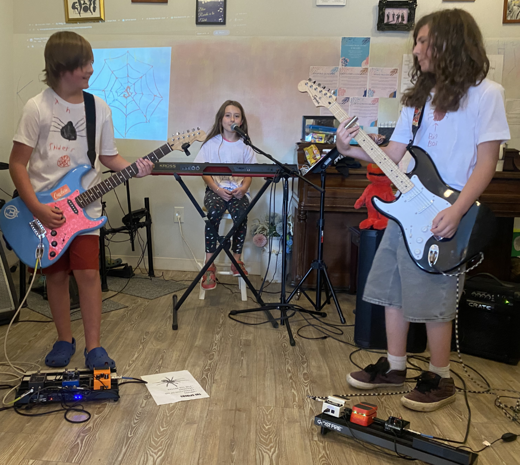 Older students rehearsing together during a focused summer music intensive in Columbus, Ohio.
