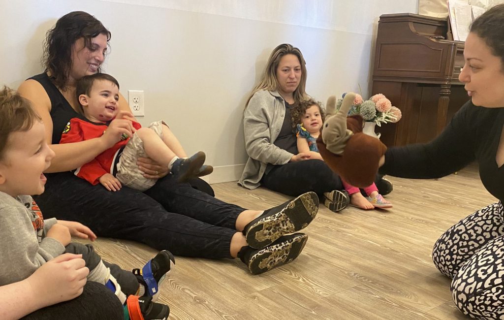 Babies and toddlers enjoy singing, playing instruments, and story time in mommy and me music time classes at Chambers Music Studio.