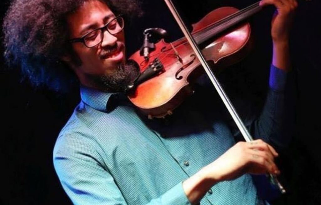 Violin teacher teaching in private music lessons at Chambers Music Studio in the greater Columbus area, part of a structured pathway that includes piano lessons and ensemble study.